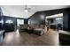 Cozy living room featuring wood floors, a ceiling fan, and vaulted ceiling at 74 Knights Ct, Dallas, GA 30157