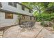 Outdoor patio features a table and chairs, perfect for dining or entertaining. Stone and siding exterior at 2596 Midway Rd, Decatur, GA 30030