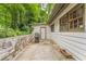 Backyard patio area featuring stone wall and outdoor grill at 2596 Midway Rd, Decatur, GA 30030
