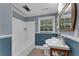 Bathroom with blue wainscotting, large tub and shower, and modern vanity at 2596 Midway Rd, Decatur, GA 30030