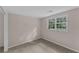 Neutral bedroom features a window providing ample natural light and plush carpeting at 2596 Midway Rd, Decatur, GA 30030