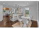 Cozy dining area with bright windows, a breakfast bar and an open concept view to the kitchen at 2596 Midway Rd, Decatur, GA 30030