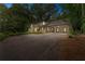 Charming stone home featuring a covered carport and a spacious driveway at 2596 Midway Rd, Decatur, GA 30030