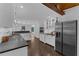 Bright kitchen with stainless steel appliances, dark countertops and hardwood flooring at 2596 Midway Rd, Decatur, GA 30030