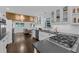 Modern kitchen featuring white cabinets, stainless steel appliances, and a view into the adjacent seating area at 2596 Midway Rd, Decatur, GA 30030