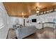 Open concept living room featuring wood ceiling, a modern kitchen and hardwood floors at 2596 Midway Rd, Decatur, GA 30030