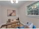 Bright office space with a desk, artwork, and a view from the window at 2596 Midway Rd, Decatur, GA 30030