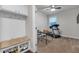Multipurpose bonus room with custom storage, work table and fitness machine at 267 Snow Owl Way, Lawrenceville, GA 30044