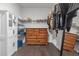 Spacious walk-in closet with built-in storage shelves, rods, and drawers at 267 Snow Owl Way, Lawrenceville, GA 30044