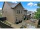 Rear exterior of home with a large deck, patio, and screened in porch at 267 Snow Owl Way, Lawrenceville, GA 30044
