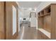 Inviting foyer with hardwood floors, coat rack, and views into the living and dining areas at 267 Snow Owl Way, Lawrenceville, GA 30044