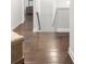 Hallway with hardwood floors, a staircase, and views to another room at 267 Snow Owl Way, Lawrenceville, GA 30044