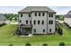 Back exterior with large windows, a deck, and a spacious backyard at 3525 Montebello Pkwy, Cumming, GA 30028