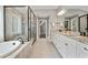 The bathroom features double sinks, tile flooring, granite counters, a soaking tub, and a separate shower at 3525 Montebello Pkwy, Cumming, GA 30028