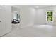 Bedroom features light colored hardwood flooring and a large bright window at 3525 Montebello Pkwy, Cumming, GA 30028