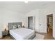 Bedroom with hardwood floors, white walls, ceiling fan, and view to the exterior at 3525 Montebello Pkwy, Cumming, GA 30028