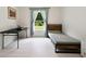 Bedroom with bright window, small bed and desk at 3525 Montebello Pkwy, Cumming, GA 30028