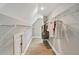 Walk-in closet with wooden floors, white walls, wire shelving and a small door accessing the attic at 3525 Montebello Pkwy, Cumming, GA 30028