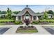 Community Clubhouse exterior view with manicured landscape and ample parking at 3525 Montebello Pkwy, Cumming, GA 30028