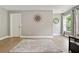 An empty room with hardwood floors, baseboards, a window, and freshly painted walls at 3525 Montebello Pkwy, Cumming, GA 30028
