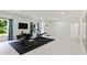 Spacious home exercise room featuring light wood flooring and natural light at 3525 Montebello Pkwy, Cumming, GA 30028