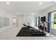 Large exercise room with neutral walls, wood floors and window to the outdoors at 3525 Montebello Pkwy, Cumming, GA 30028