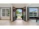 Elegant foyer with dark hardwood floors and double doors at 3525 Montebello Pkwy, Cumming, GA 30028