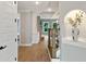 Hallway with staircase and niche, hardwood flooring and fresh paint at 3525 Montebello Pkwy, Cumming, GA 30028