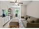 Inviting living room provides a comfortable sofa, work desk, and storage cabinets for relaxing and productive living at 3525 Montebello Pkwy, Cumming, GA 30028