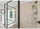 Modern shower with gray tile walls, a bronze shower head, and a glass enclosure and a soaking tub at 3525 Montebello Pkwy, Cumming, GA 30028