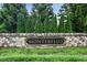 Neighborhood sign made of rock with Montebello nameplate at 3525 Montebello Pkwy, Cumming, GA 30028