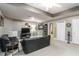 Basement entertainment area with leather couches, television and neutral carpet at 3780 Summit Gate Dr, Suwanee, GA 30024