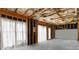 Unfinished basement featuring exposed rafters and beams, and a concrete slab floor at 3780 Summit Gate Dr, Suwanee, GA 30024