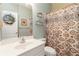 Bathroom featuring a patterned shower curtain, floral arrangements, and neutral wall paint at 3780 Summit Gate Dr, Suwanee, GA 30024