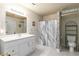 Bathroom with a white vanity and marble-look shower curtain near the white toilet at 3780 Summit Gate Dr, Suwanee, GA 30024