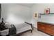 Bedroom with neutral carpet, modern décor and a dark-stained dresser and queen-sized bed at 3780 Summit Gate Dr, Suwanee, GA 30024