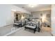 This bedroom features two beds, a mirror wall, and a neutral color palette at 3780 Summit Gate Dr, Suwanee, GA 30024