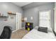 Gray bedroom featuring a window, gray carpet, cube storage and a twin-sized bed at 3780 Summit Gate Dr, Suwanee, GA 30024
