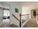 Hallway with a railing and access to multiple rooms at 3780 Summit Gate Dr, Suwanee, GA 30024