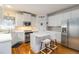 Beautiful kitchen with stainless steel appliances, white cabinets, and a center island at 3780 Summit Gate Dr, Suwanee, GA 30024