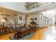 Sunlit living room featuring a high ceiling, hardwood floors, and traditional furnishings at 3780 Summit Gate Dr, Suwanee, GA 30024