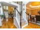 Open-concept living room with hardwood floors and fireplace and adjacent dining room at 3780 Summit Gate Dr, Suwanee, GA 30024