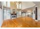 Open living room with fireplace, large windows, and hardwood floors at 3780 Summit Gate Dr, Suwanee, GA 30024