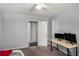 Neutral bedroom with an open doorway and adjacent study area at 3946 Flakes Mill Rd, Decatur, GA 30034