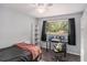 Bedroom with a desk, shelves, and a view of the outdoors at 3946 Flakes Mill Rd, Decatur, GA 30034