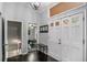 Entryway featuring a double door entrance, coat rack, dark hardwood flooring, and neutral paint at 3946 Flakes Mill Rd, Decatur, GA 30034