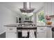 Contemporary kitchen view into the living room, showcasing a stainless steel range and bright design at 3946 Flakes Mill Rd, Decatur, GA 30034