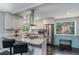Well-equipped kitchen boasts granite countertops, stainless steel appliances, and a sleek island with bar seating at 3946 Flakes Mill Rd, Decatur, GA 30034