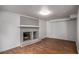 Living room featuring a painted brick fireplace and neutral decor at 3946 Flakes Mill Rd, Decatur, GA 30034