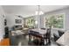 Open-concept living area showcasing seamless flow between living and dining spaces with abundant natural light at 3946 Flakes Mill Rd, Decatur, GA 30034